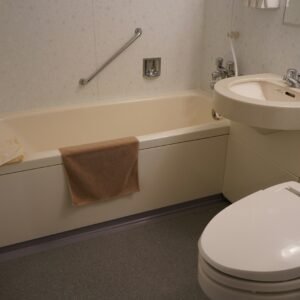 a bathroom with a tub sink and toilet
